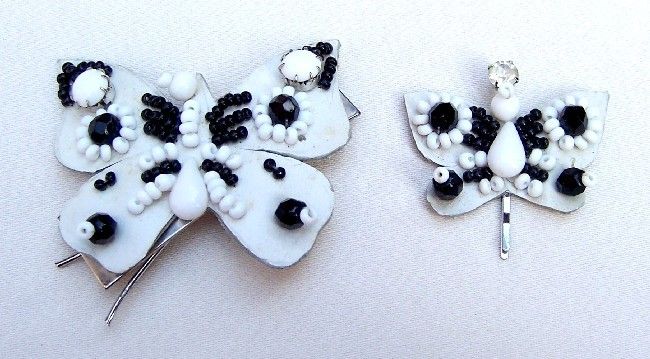 LOT OF TWO BLACK AND WHITE BUTTERFLY HAIR ORNAMENTS OR BARRETTES 
